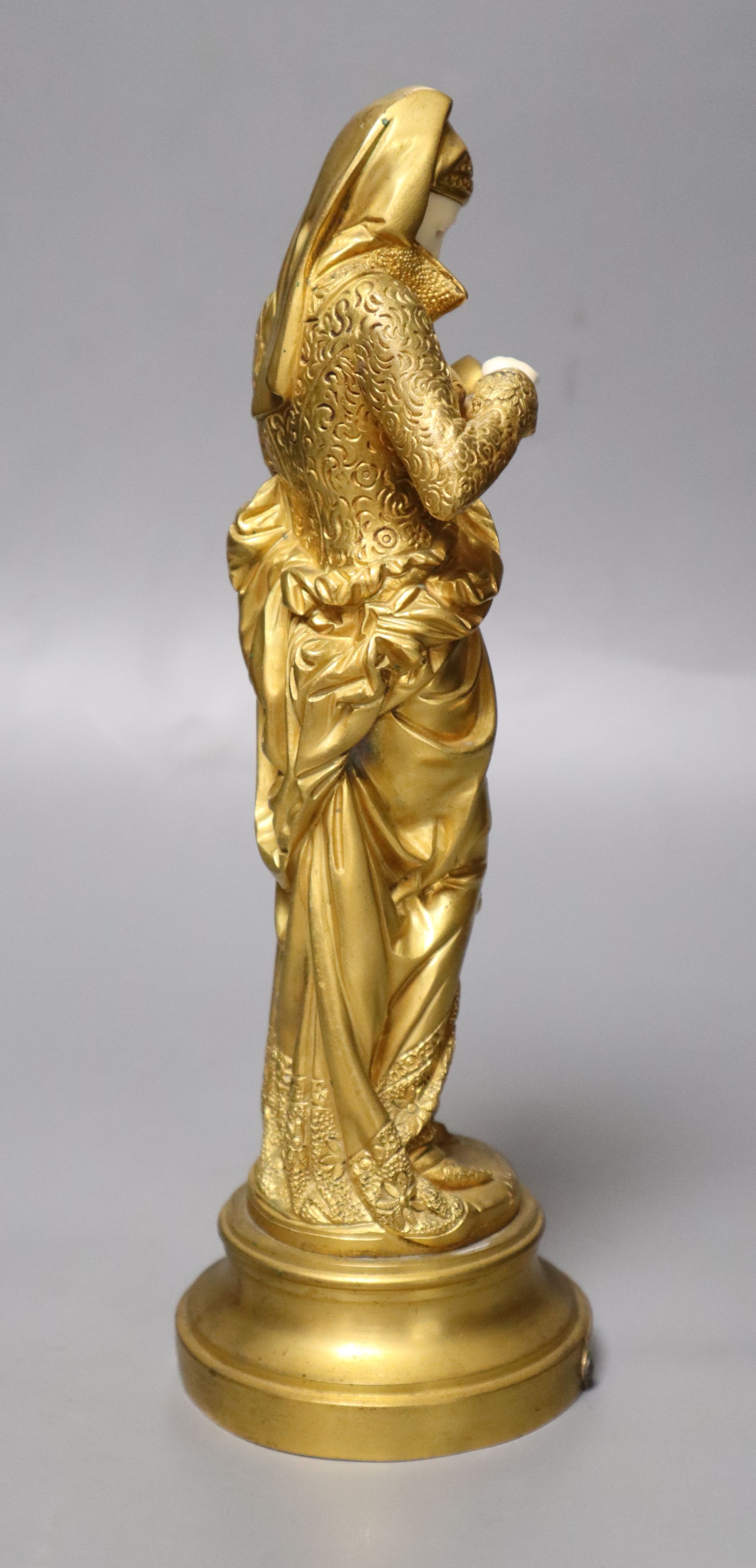 After Carrier-Belleuse. A gilt bronze and ivory figure, height 25cm